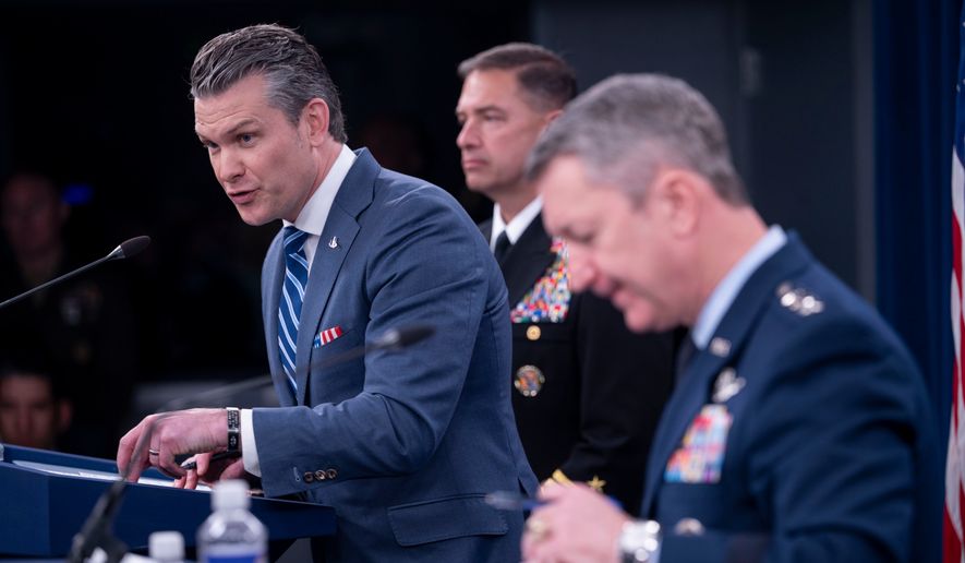 Defense Secretary Pete Hegseth speaks to members of the media during a press briefing with Adm. Brad Cooper, center, and Chairman of the Joint Chiefs of Staff Gen. Dan Caine, right, at the Pentagon, Thursday, April 16, 2026 in Washington. (AP Photo/Kevin Wolf) **FILE**