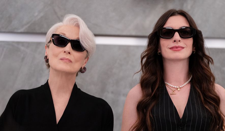 This image released by 20th Century Studios shows Meryl Streep, left, and Anne Hathaway in a scene from "The Devil Wears Prada 2." (Macall Polay/20th Century Studios via AP)