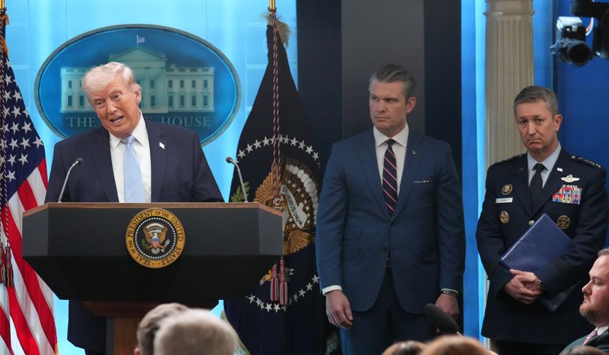 President Donald Trump speaks with reporters during a news conference in the James Brady Press Briefing Room at the White House, Monday, April 6, 2026, in Washington, as Defense Secretary Pete Hegseth and Chairman of the Joint Chiefs of Staff Gen. Dan Caine listen. (AP Photo/Mark Schiefelbein, File)