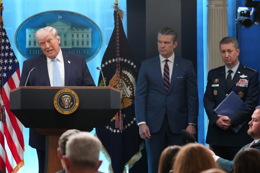 President Donald Trump speaks with reporters during a news conference in the James Brady Press Briefing Room at the White House, Monday, April 6, 2026, in Washington, as Defense Secretary Pete Hegseth and Chairman of the Joint Chiefs of Staff Gen. Dan Caine listen. (AP Photo/Mark Schiefelbein, File)