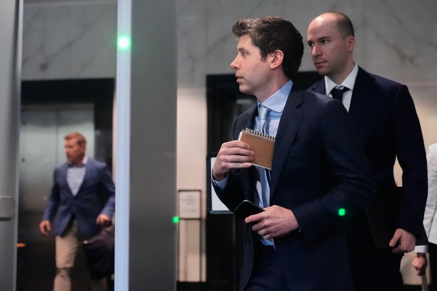 Sam Altman, center, and OpenAI president Greg Brockman, right, arrive at the U.S. District Court in Oakland, Calif., Thursday, April 30, 2026. (AP Photo/Godofredo A. Vásquez)