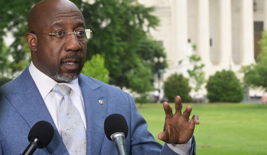Sen. Raphael Warnock, D-Ga., holds a news conference regarding the Supreme Court Voting Rights decision on Capitol Hill, Wednesday, April 29, 2026, in Washington. (AP Photo/Rod Lamkey Jr.)