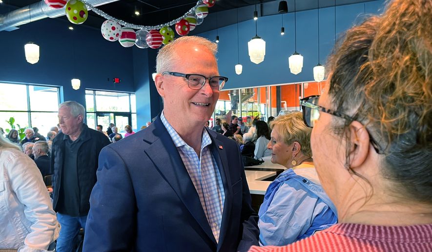 Adam Hamilton, a Methodist mega-church pastor from Kansas, talks to voters as he wraps up a U.S. Senate listening tour on Saturday, April 18, 2026, at Limitless Brewing in Lenexa, Kansas. (AP Photo/Heather Hollingsworth)