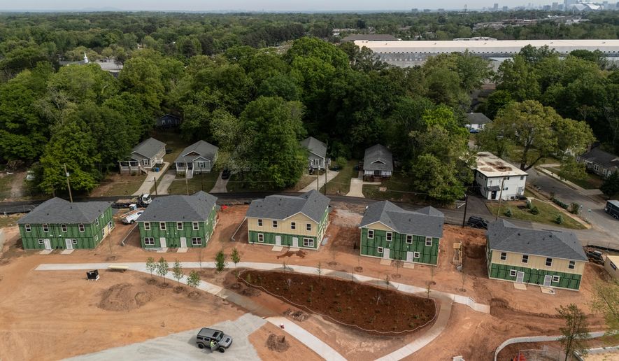 New homes under construction are seen in Langston Park, April 13, 2026, in Atlanta. (AP Photo/Mike Stewart)
