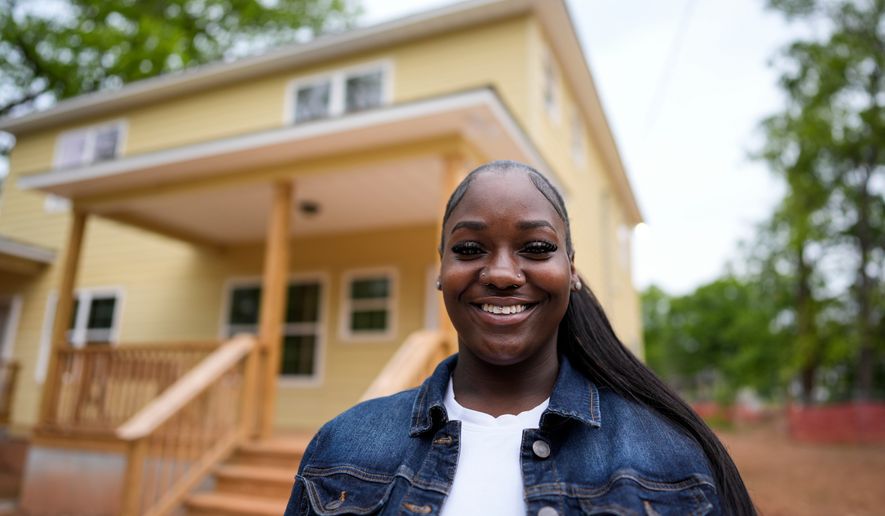 Home owner Phileena Daniel poses for a photo in Langston Park, April 13, 2026, in Atlanta. (AP Photo/Mike Stewart)