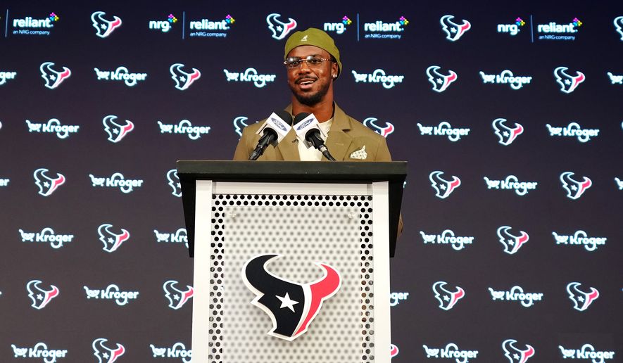 Houston Texans' Azeez Al-Shaair talks about his contract extension during a press conference at the NFL football team's facility, Friday, May 1, 2026, in Houston. (AP Photo/Karen Warren)