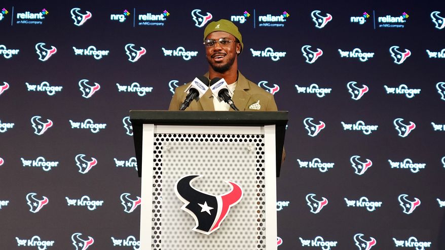 Houston Texans' Azeez Al-Shaair talks about his contract extension during a press conference at the NFL football team's facility, Friday, May 1, 2026, in Houston. (AP Photo/Karen Warren)