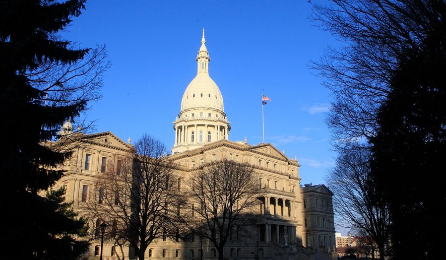 The state Capitol building in Lansing, Mich., is seen on Dec. 12, 2012. (AP Photo/Carlos Osorio) **FILE**
