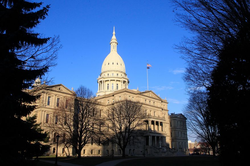 The state Capitol building in Lansing, Mich., is seen on Dec. 12, 2012. (AP Photo/Carlos Osorio) **FILE**