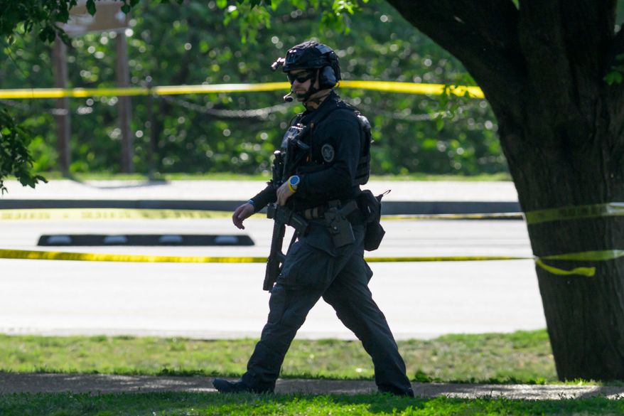 Police respond after a person was shot by law enforcement near the Washington Monument in Washington, Monday, May 4,, 2026. (AP Photo/Rod Lamkey Jr.)