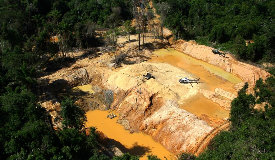 FILE - An illegal mining camp is visible from a Brazil Environmental Agency helicopter during an operation to try to contain illegal mining in Yanomami Indigenous territory, Roraima state, Brazil, Feb. 11, 2023. (AP Photo/Edmar Barros, File)