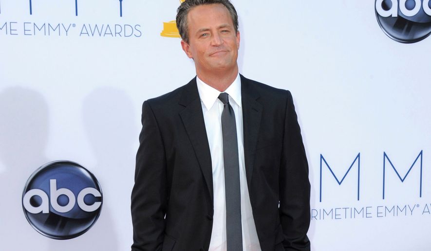 FILE - Actor Matthew Perry arrives at the 64th Primetime Emmy Awards in Los Angeles on Sept. 23, 2012. (Photo by Jordan Strauss/Invision/AP, File)
