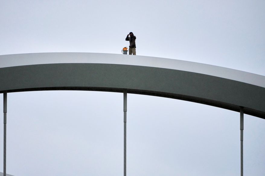 Guido Reichstadter, 45, is seen on top of the Frederick Douglass Bridge, Wednesday, May 6, 2026 in Washington. (AP Photo/Julia Demaree-Nikhinson)