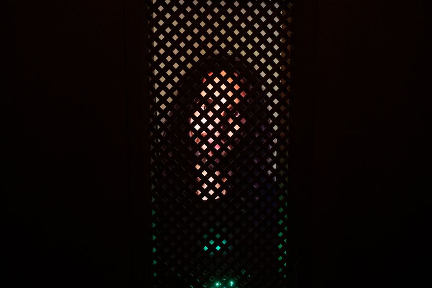 An experimental art installation with an AI Jesus entitled, Deus in Machina, installed in a confessional in St. Peter's Chapel in the old town of Lucerne, Switzerland, Aug. 25, 2024. (Urs Flueeler/Keystone via AP, File)