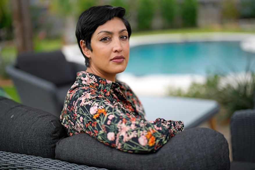 Rumman Chowdhury, co-founder of Humane Intelligence, a nonprofit developing accountable AI systems, poses for a photograph at her home May 8, 2023, in Katy, Texas. (AP Photo/David J. Phillip, File)