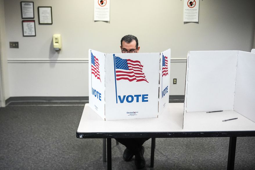 A person votes in the Virginia redistricting referendum at Fairfax Government Center, Tuesday, April 21, 2026, in Fairfax, Va. (AP Photo/Julia Demaree Nikhinson)