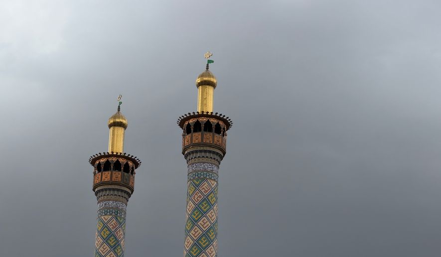 Minarets of a mosque are seen in cloudy weather of Tehran, Iran, Friday, May 8, 2026. (AP Photo/Vahid Salemi)