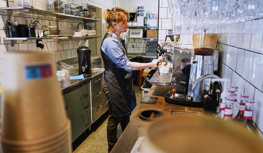 Barista Kajetan Grzelczak makes a coffee at Andon Café at the Vasastan neighborhood in Stockholm, Sweden, Tuesday, May 5, 2026. (AP Photo/James Brooks)