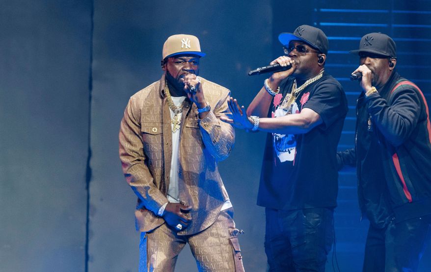FILE - Rapper Curtis "50 Cent" Jackson, left, performs at the German launch of his "Final Lap Tour" at Hamburg's Barclays Arena in Hamburg, Germany, Friday, Sept. 29, 2023. (Markus Scholz/dpa via AP, File)