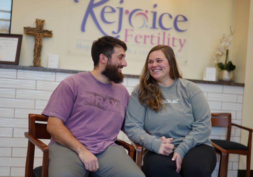 IVF patients Domenic and Olivia D'Agostino sit for a portrait at Rejoice Fertility, Jan. 8, 2026, in Knoxville, Tenn. (AP Photo/Jessie Wardarski)