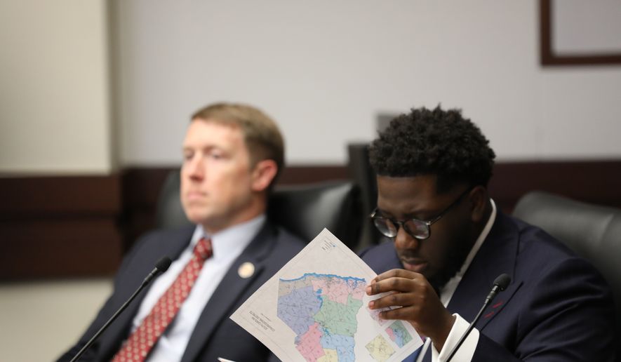 South Carolina Democratic Rep. Keishan Scott looks at a proposed U.S. House district map during a redistricting hearing in a state House Judiciary subcommittee on Tuesday, May, 12 2026, in Columbia, S.C. (AP Photo/Jeffrey Collins)