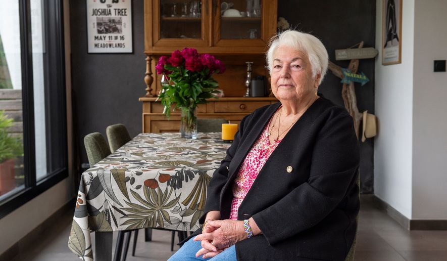 Marie-Therese Ross-Mahe, an 85-year-old French widow of a U.S. military veteran, poses in Orvault, western France, during an interview with The Associated Press, Monday, May 11, 2026. (AP Photo/Mathieu Pattier)