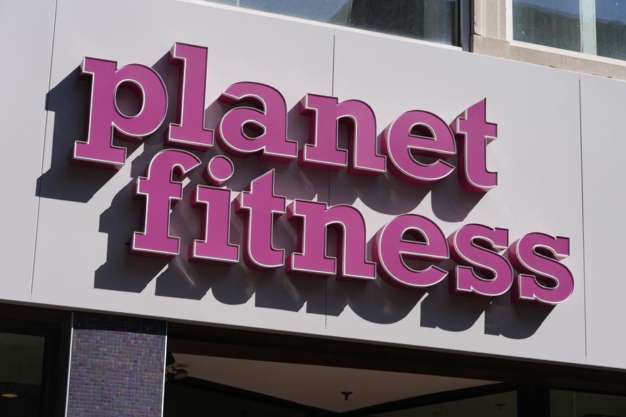 A Planet Fitness sign is seen at one of their fitness centers, Thursday, March 14, 2024, in Boston. (AP Photo/Michael Dwyer)