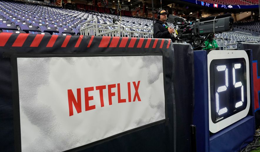 FILE - A Netflix banner is seen before an NFL football game between the Houston Texans and the Baltimore Ravens, Dec. 25, 2024, in Houston. (AP Photo/David J. Phillip, File)