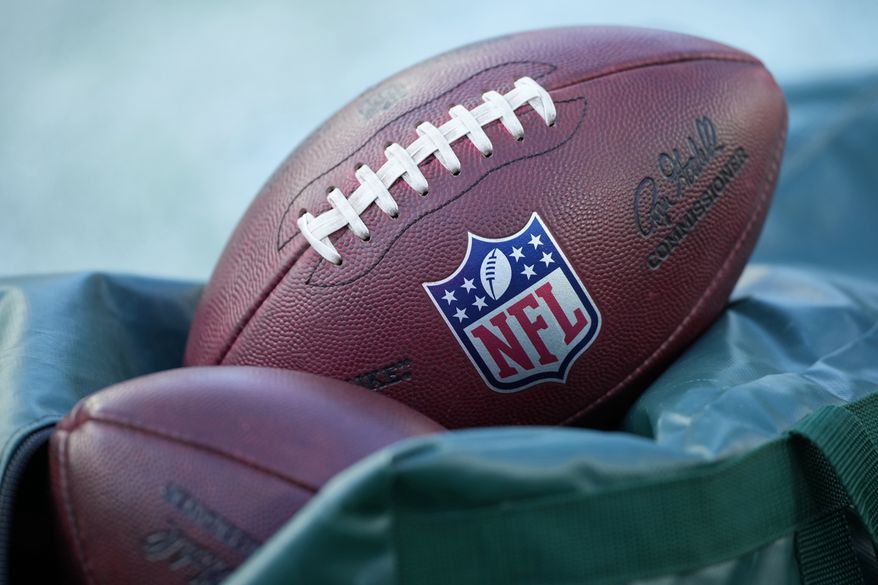 Footballs are seen before an NFL football game between the Philadelphia Eagles and the Washington Commanders on Jan. 4, 2026, in Philadelphia. (AP Photo/Matt Slocum, File)