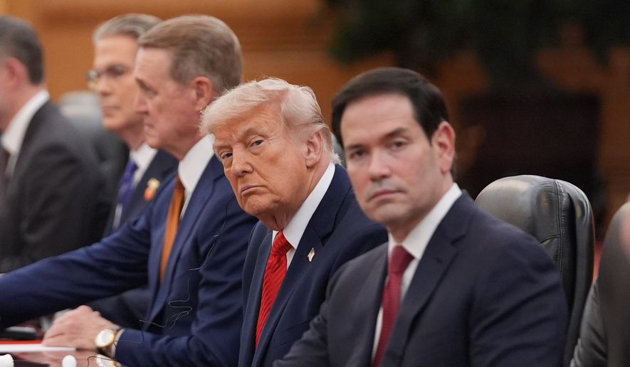 President Donald Trump meets with China's President Xi Jinping at the Great Hall of the People, Thursday, May 14, 2026, in Beijing, as Secretary of State Marco Rubio watches. (AP Photo/Mark Schiefelbein) ** FILE **