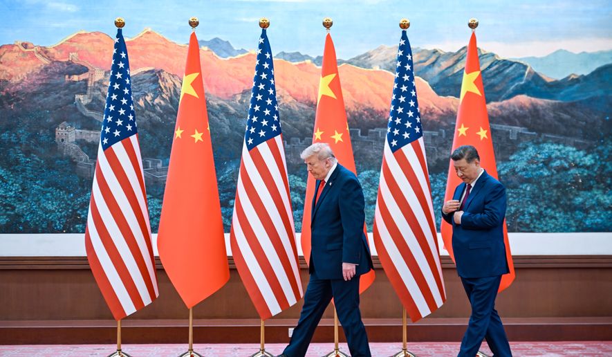 Chinese President Xi Jinping, right, and U.S. President Donald Trump meet at the Great Hall of the People in Beijing, Thursday, May 14, 2026. (Kenny Holston/Pool Photo via AP)