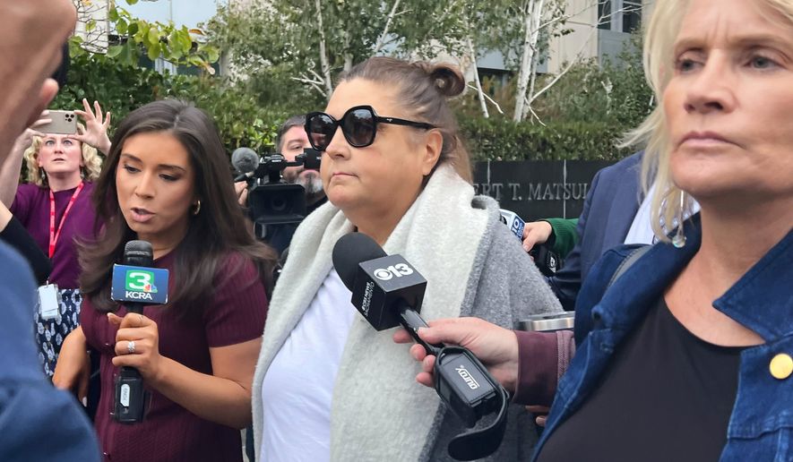 Dana Williamson, a former top aide to Gov. Gavin Newsom, center, leaves the federal courthouse in Sacramento, Calif., on Nov. 12, 2025. (AP Photo/Sophie Austin, File)
