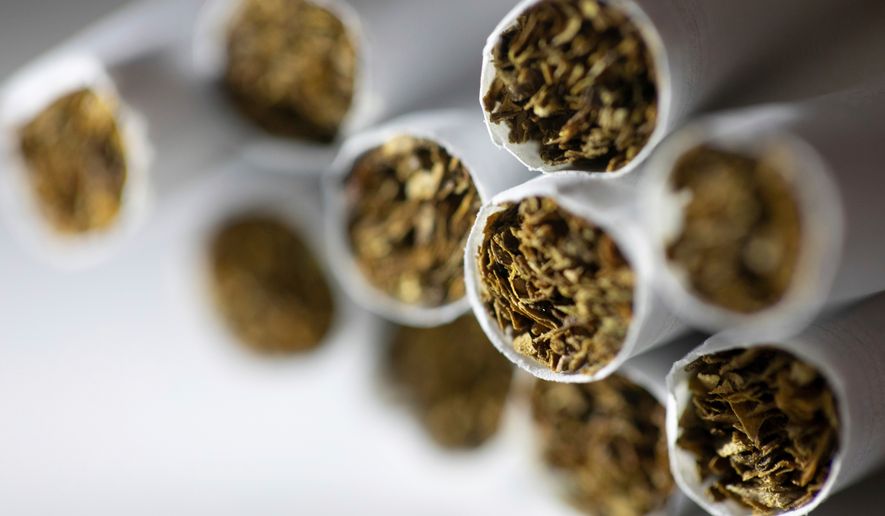FILE - Cigarettes are arranged for a photograph in New York on Dec. 17, 2019. (AP Photo/Patrick Sison, File)