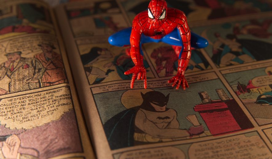 A Spiderman figurine sits atop a facsimile copy of the May 1939 Detective Comics anthology series in Phoenix, Thursday May 14, 2026. This issue made history for including the debut of the Batman superhero in a story called "The Case of the Chemical Syndicate". (AP Photo/Dario Lopez-Mills)
