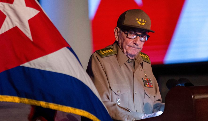 Former Cuban President Raul Castro looks at the Cuban flag during his speech at the event celebrating the 65th anniversary of the triumph of the revolution in Santiago, Cuba, Jan. 1, 2024. (AP Photo/Ismael Francisco, File)