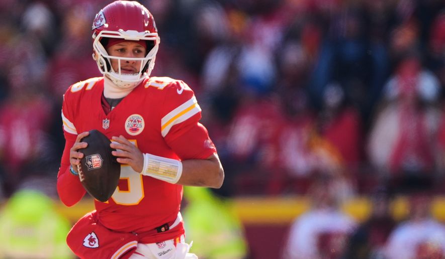 FILE - Kansas City Chiefs quarterback Patrick Mahomes looks to pass during the first half of an NFL football game against the Los Angeles Chargers, Dec. 14, 2025, in Kansas City, Mo. (AP Photo/Charlie Riedel, File)