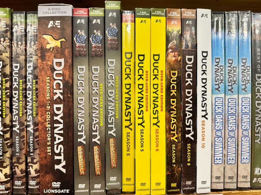 AE TV reality Duck Dynasty show series from the 2010s, complete series DVDs on a shelf. Manassas, Virginia - September 29, 2024: Photo credit: melissamn via Shutterstock.