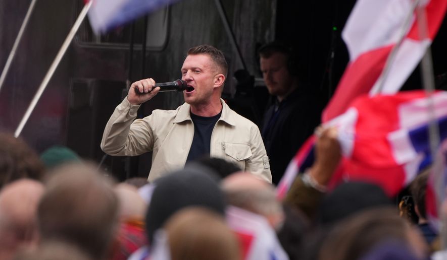 Far-right agitator Stephen Yaxley-Lennon, known by his pseudonym Tommy Robinson speaks during an Unite the Kingdom rally in London, Saturday, May 16, 2026.(AP Photo/Kirsty Wigglesworth)
