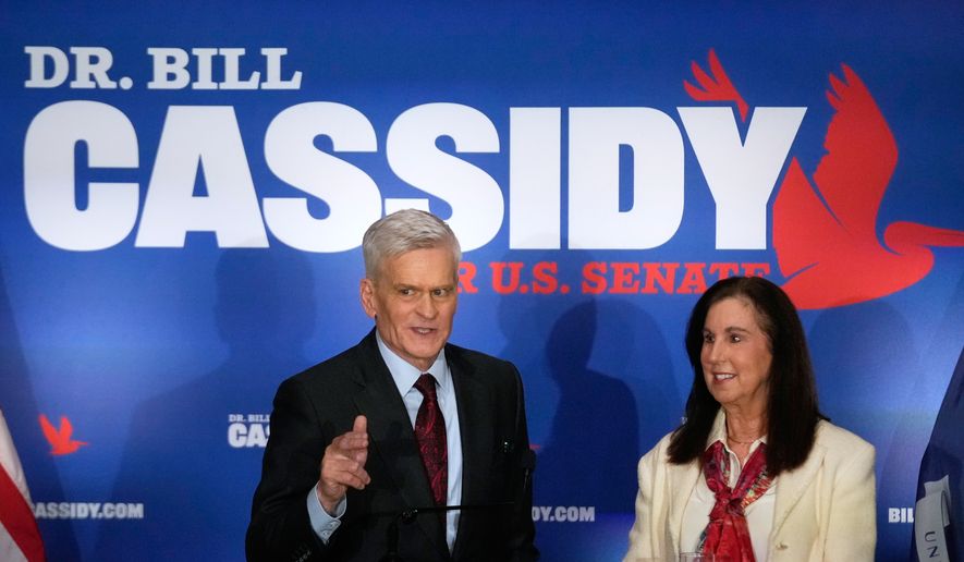 Sen. Bill Cassidy, R-La., left, speaks to supporters alongside his wife, Laura, during an election night watch party Saturday, May 16, 2026, in Baton Rouge, La. (AP Photo/Gerald Herbert)
