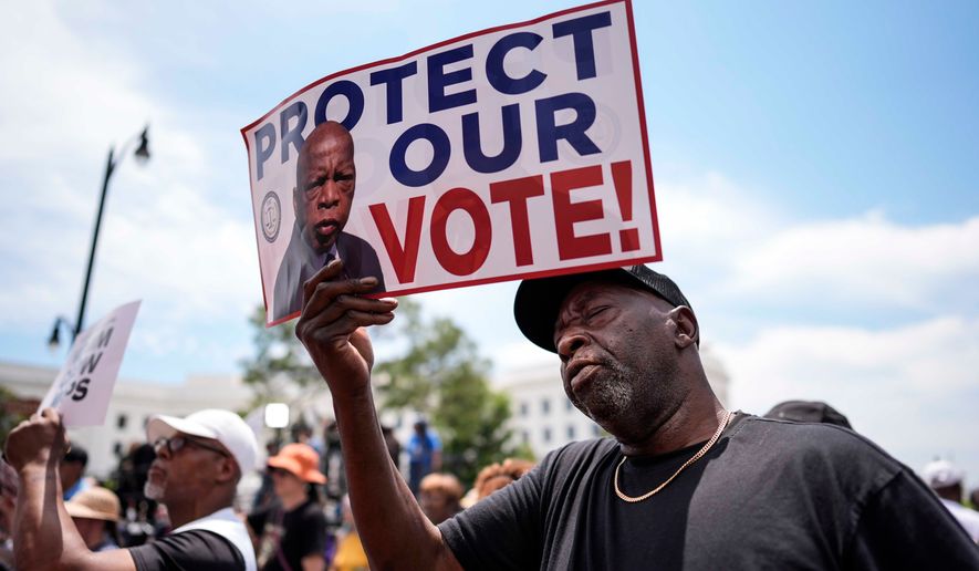 Aaron McGuire sings a spirtual song during a voting rally, Saturday, May 16, 2026, in Montgomery, Ala. (AP Photo/Mike Stewart)
