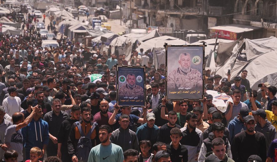 Palestinians attend the funeral of Izz al-Din al-Haddad, the leader of Hamas' Qassam Brigades, and his daughter and wife in Gaza City, Saturday, May 16, 2026. They were killed in an Israeli strike Friday evening. (AP Photo/Abdel Kareem Hana)