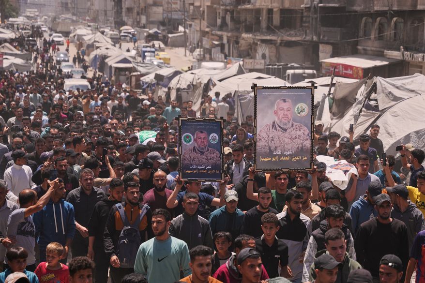 Palestinians attend the funeral of Izz al-Din al-Haddad, the leader of Hamas' Qassam Brigades, and his daughter and wife in Gaza City, Saturday, May 16, 2026. They were killed in an Israeli strike Friday evening. (AP Photo/Abdel Kareem Hana)