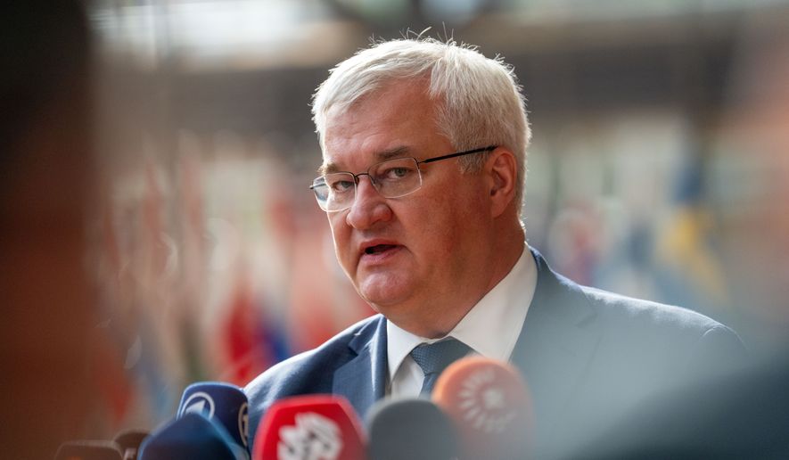 Ukraine's Foreign Minister Andrii Sybiha speaks with the media as she arrives for a meeting of EU foreign ministers at the European Council building in Brussels, Monday, May 11, 2026. (AP Photo/Marius Burgelman)