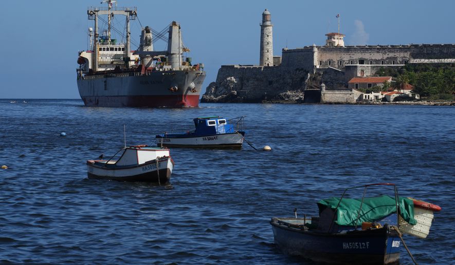 The Asian Katra cargo ship, top left, arrives in Havana Bay in Havana, Cuba, Monday, May 18, 2026. (AP Photo/Ramon Espinosa)