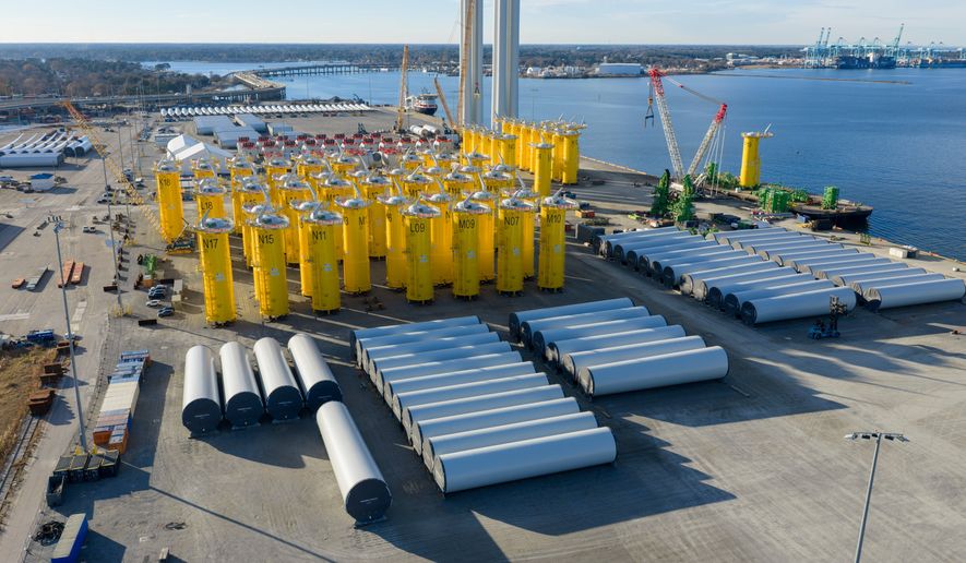FILE - Wind turbine bases, generators and blades are positioned along with support ships at The Portsmouth Marine terminal at the staging area for Dominion Energy's wind turbine project Monday Dec. 22, 2025, in Portsmouth, Va. (AP Photo/Steve Helber, File)