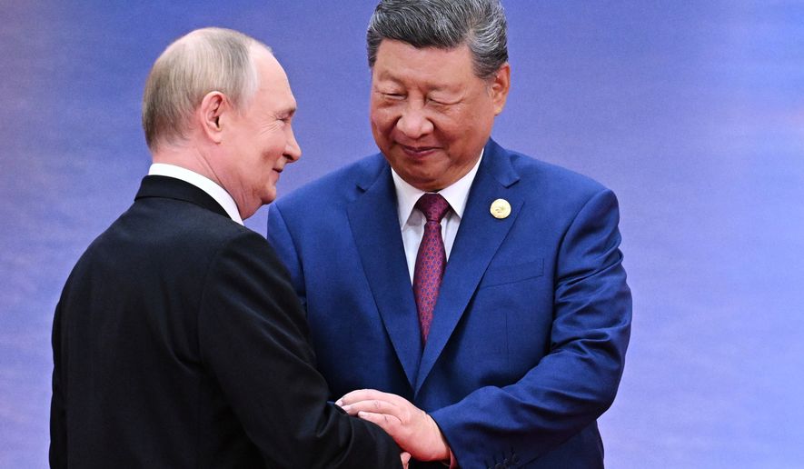 Russian President Vladimir Putin, left, and Chinese President Xi Jinping greet each other in Tianjin, China, on Aug. 31, 2025. (Sergei Bobylev, Sputnik, Kremlin Pool Photo via AP, File)