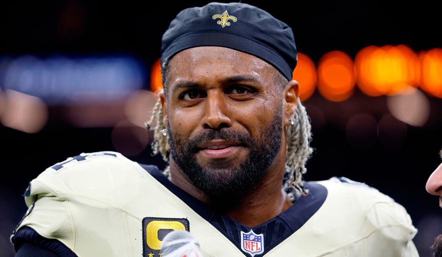 FILE - New Orleans Saints defensive end Cameron Jordan (94) is interviewed by WWL Radio after an NFL football game against the New York Jets, Dec. 21, 2025, in New Orleans. (AP Photo/Tyler Kaufman, File)