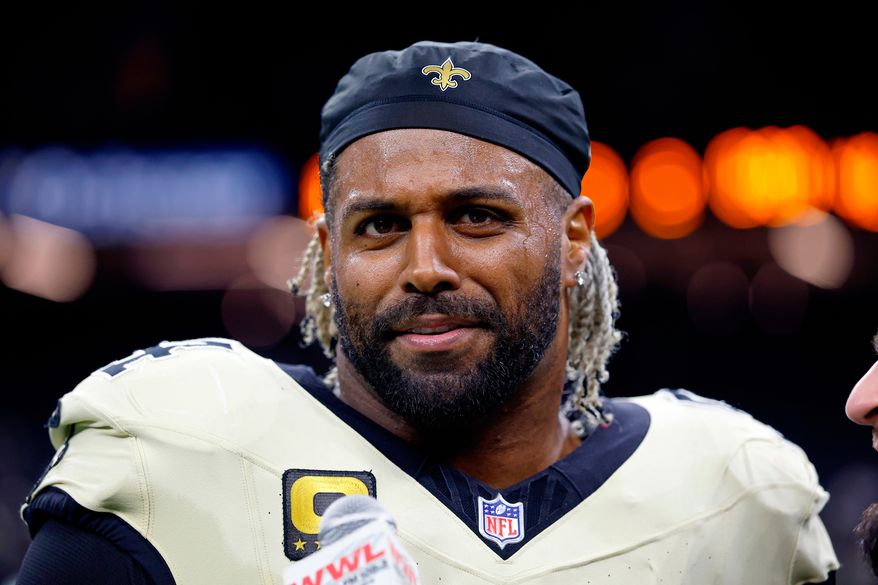 FILE - New Orleans Saints defensive end Cameron Jordan (94) is interviewed by WWL Radio after an NFL football game against the New York Jets, Dec. 21, 2025, in New Orleans. (AP Photo/Tyler Kaufman, File)