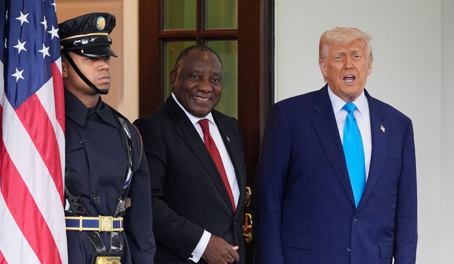 President Donald Trump greets South African President Cyril Ramaphosa, center, at the White House, May 21, 2025, in Washington. (AP Photo/Julia Demaree Nikhinson, File)