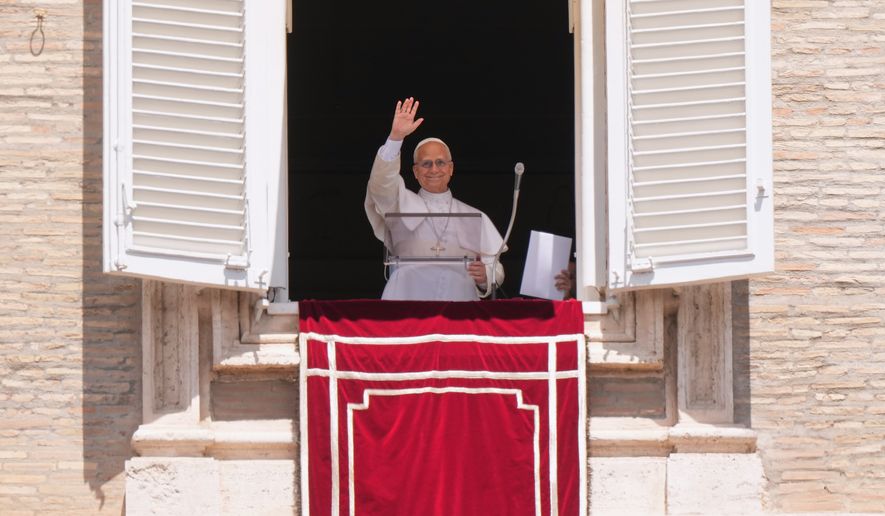 Pope Leo XIV delivers his blessing as he recites the Regina Coeli noon prayer from the window of his studio overlooking St. Peter's Square, at the Vatican, Sunday, May 17, 2026. (AP Photo/Andrew Medichini)